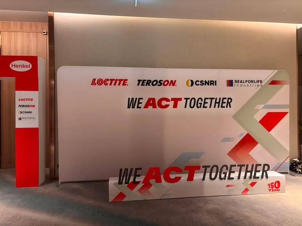 แบ็คดรอป Henkel We Act Together พร้อมโลโก้ Loctite Teroson CSNRI
